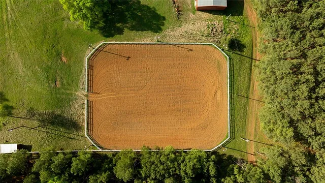 a view of a swimming pool with a yard