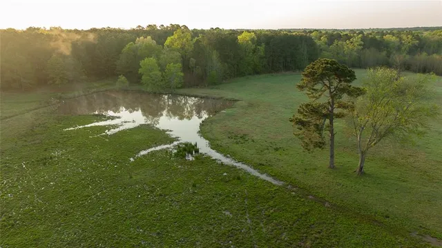 a view of a lake with a yard