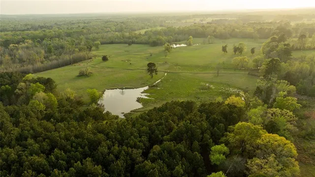a view of a lake with a yard