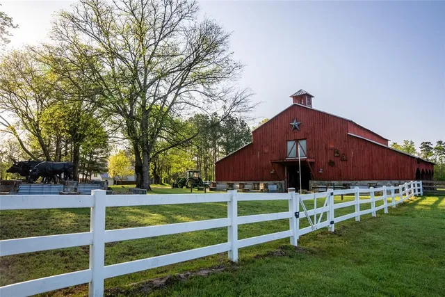 a living room with lots of furniture and a chandelier