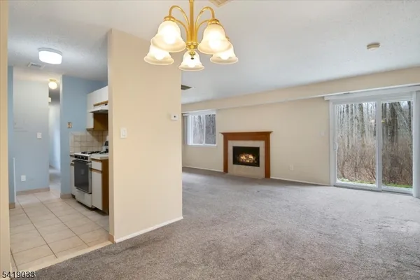 a view of a kitchen with a stove cabinets and a kitchen