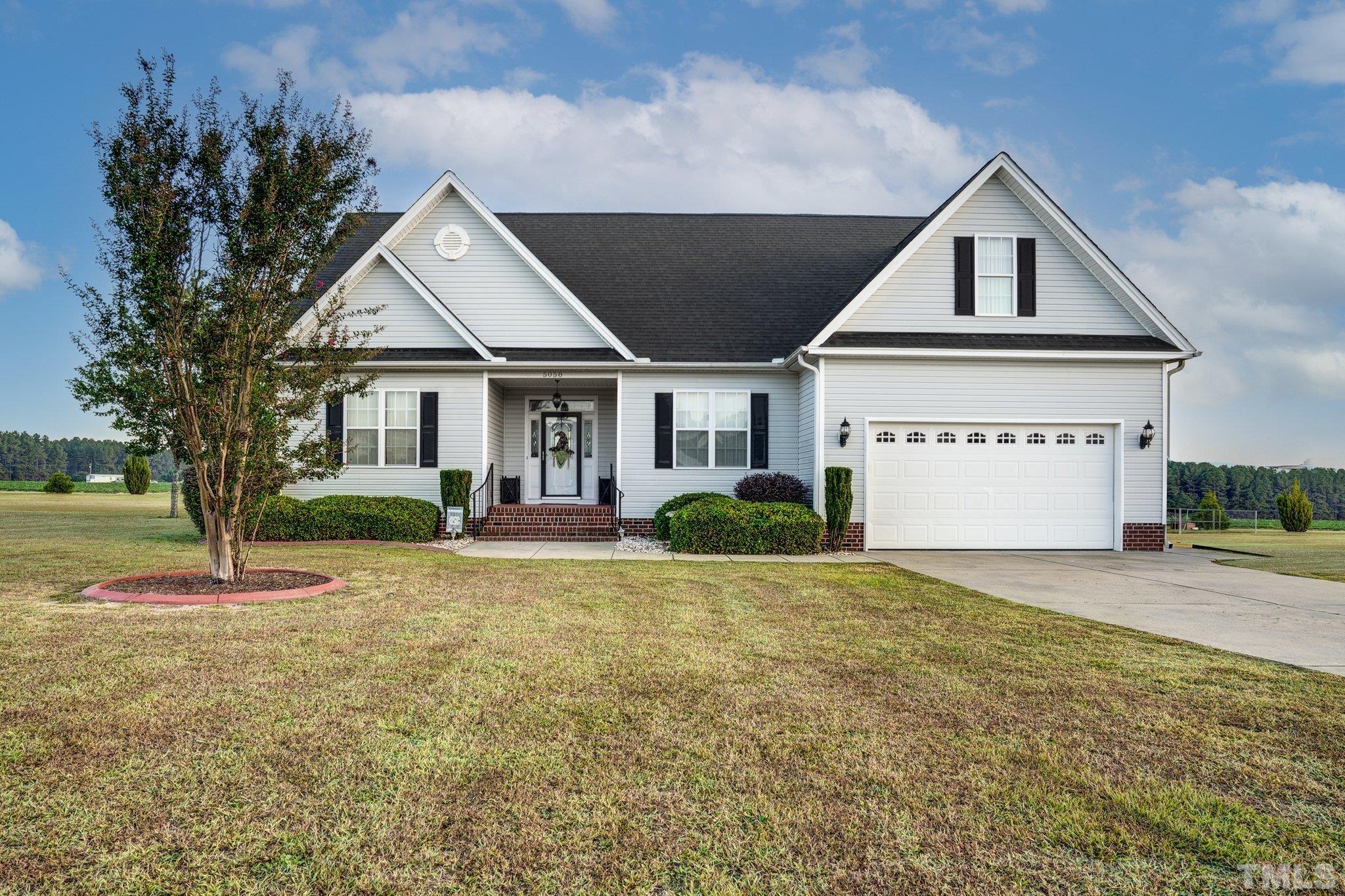 5058 Colorado Road Bailey, NC 27807 - Photo 1 of 27 a front view of a house with a yard