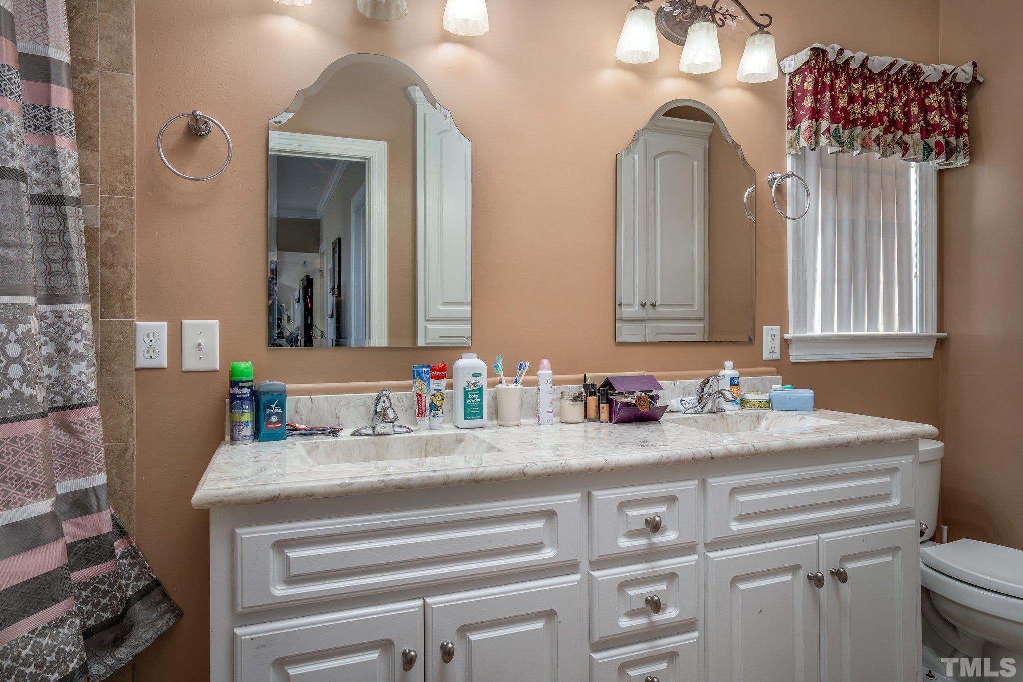 5058 Colorado Road Bailey, NC 27807 - Photo 14 of 27 a bathroom with a sink vanity and a mirror