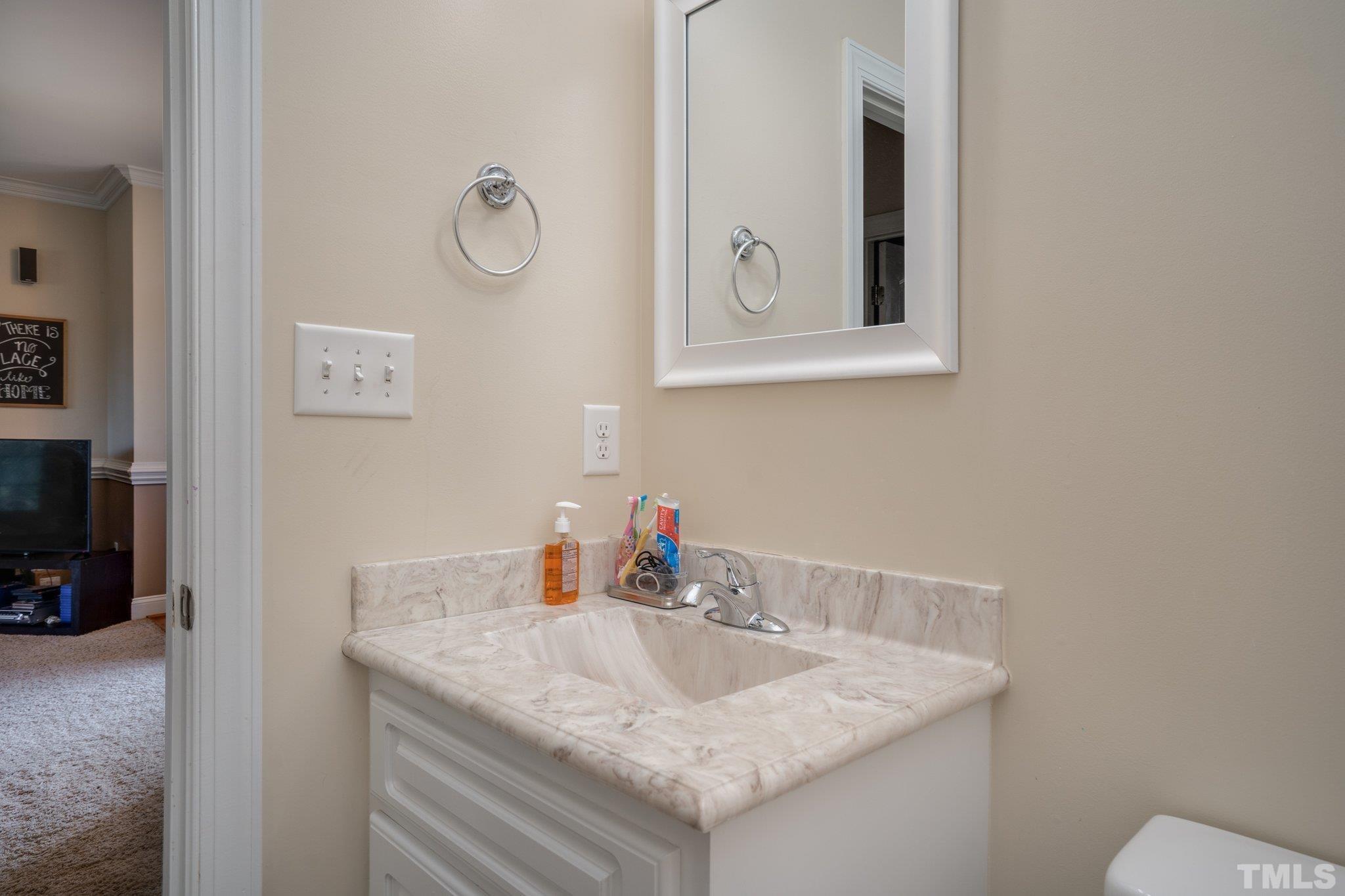 5058 Colorado Road Bailey, NC 27807 - Photo 18 of 27 a bathroom with a sink vanity and a mirror