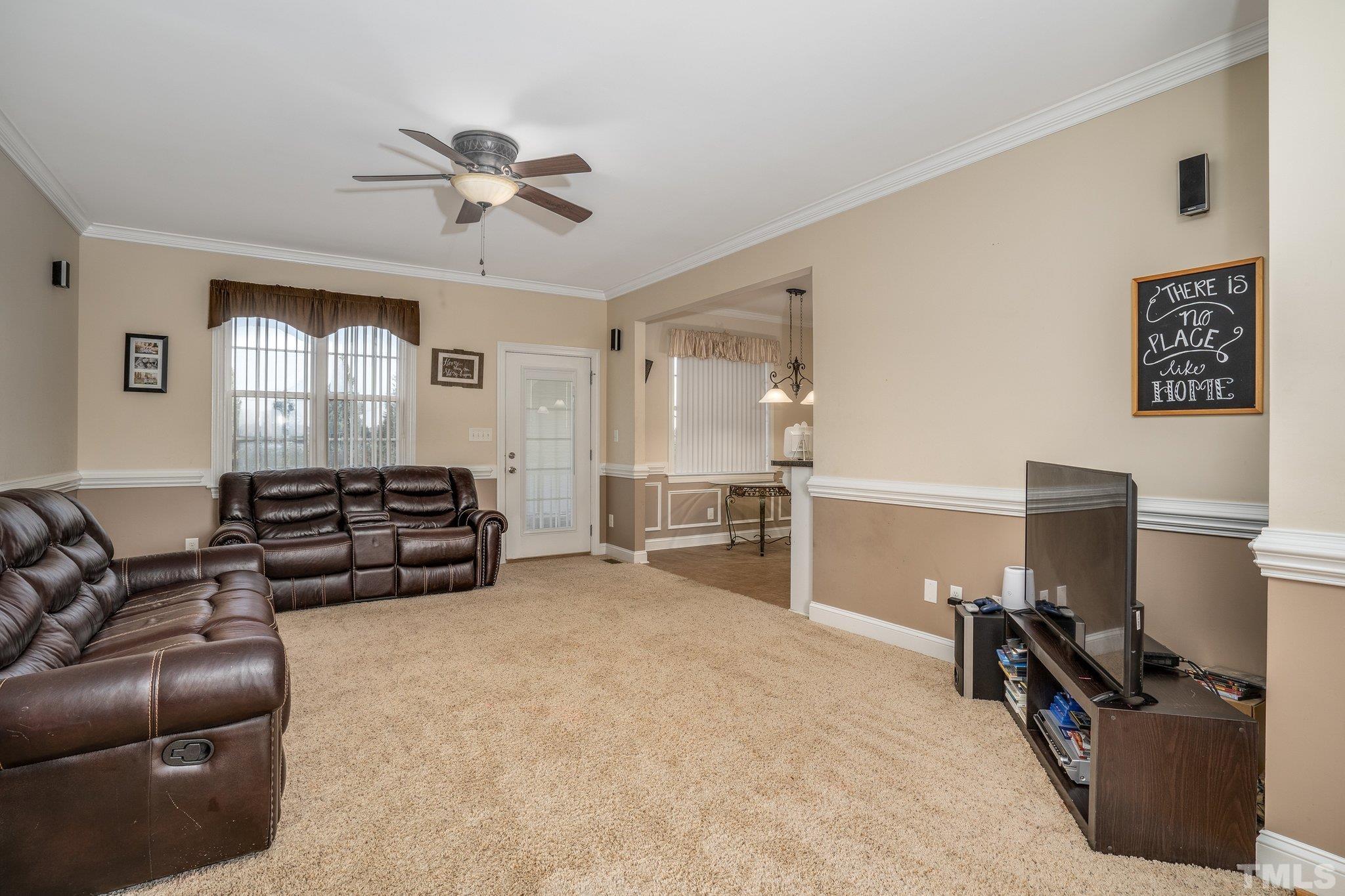 5058 Colorado Road Bailey, NC 27807 - Photo 3 of 27 a living room with furniture and a flat screen tv
