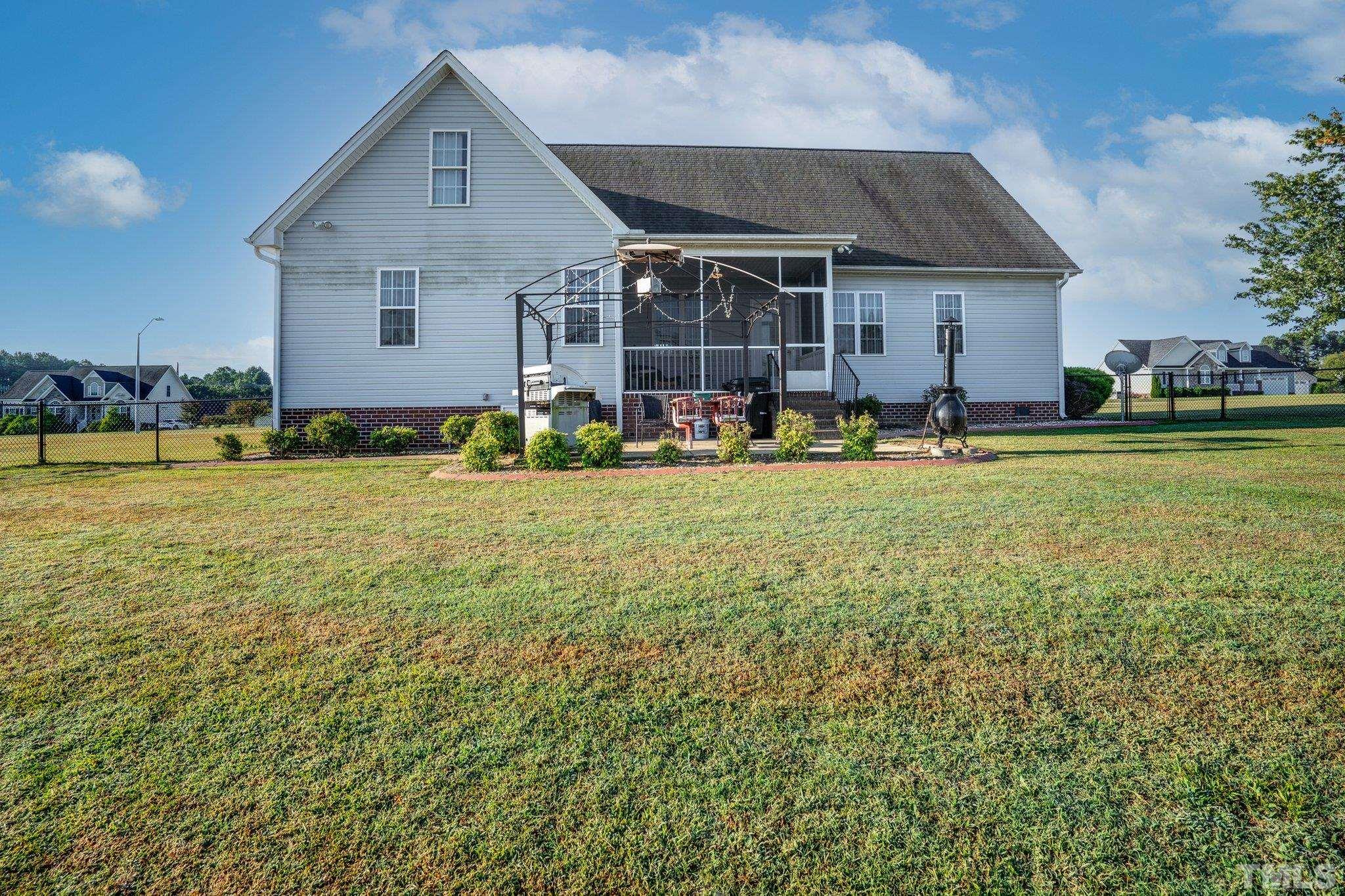 5058 Colorado Road Bailey, NC 27807 - Photo 24 of 27 a house with swimming pool in front of it