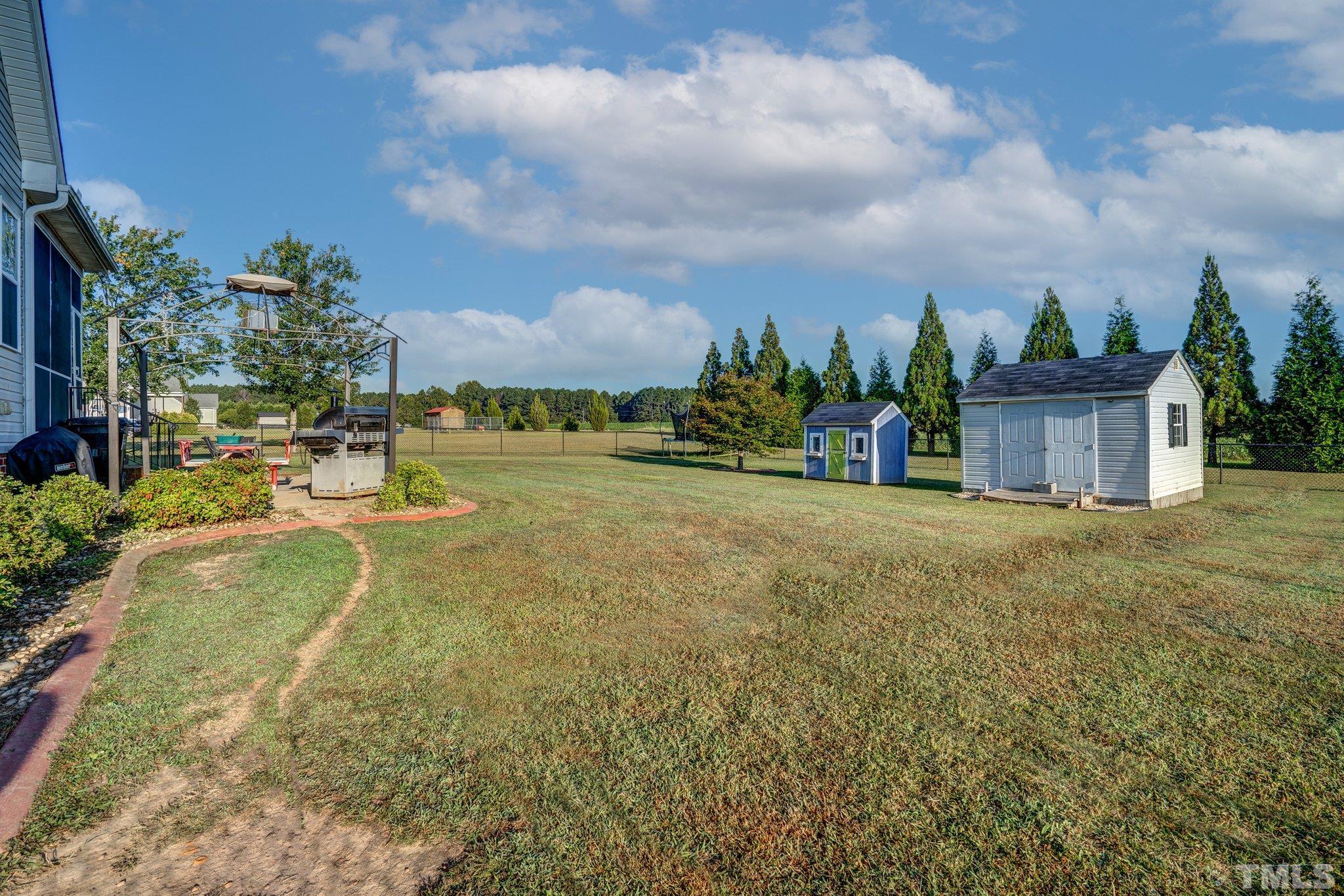 5058 Colorado Road Bailey, NC 27807 - Photo 26 of 27 a view of a house with a yard and sitting area