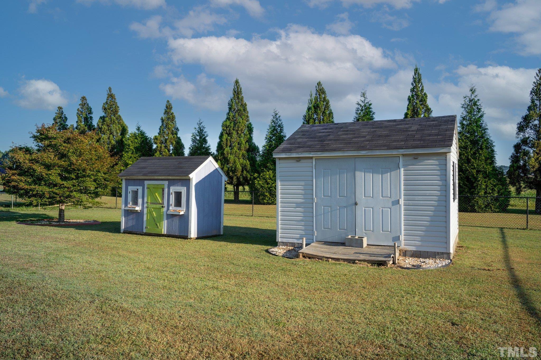 5058 Colorado Road Bailey, NC 27807 - Photo 27 of 27 a front view of a house with a yard and garage
