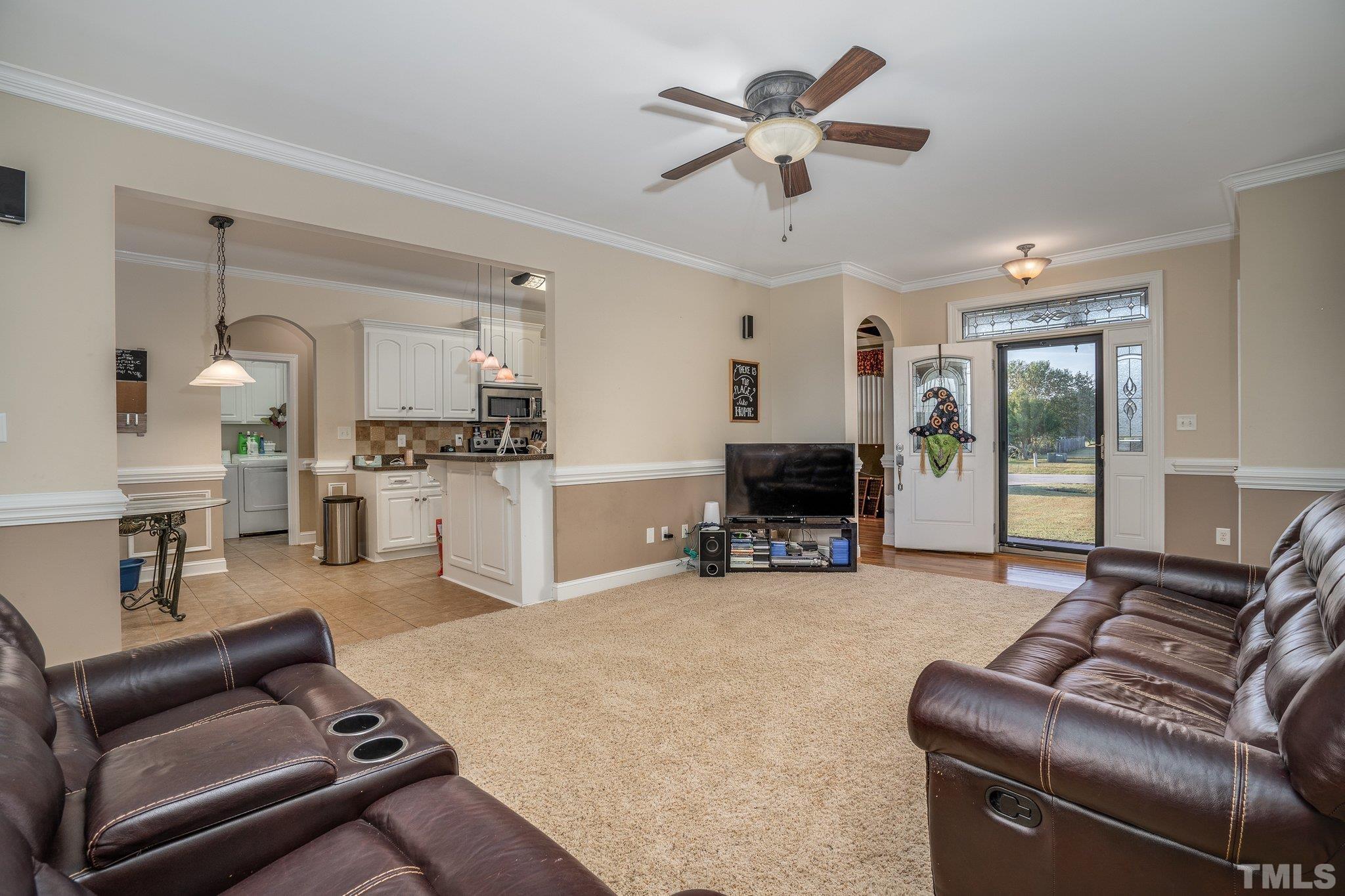5058 Colorado Road Bailey, NC 27807 - Photo 4 of 27 a living room with furniture and a flat screen tv