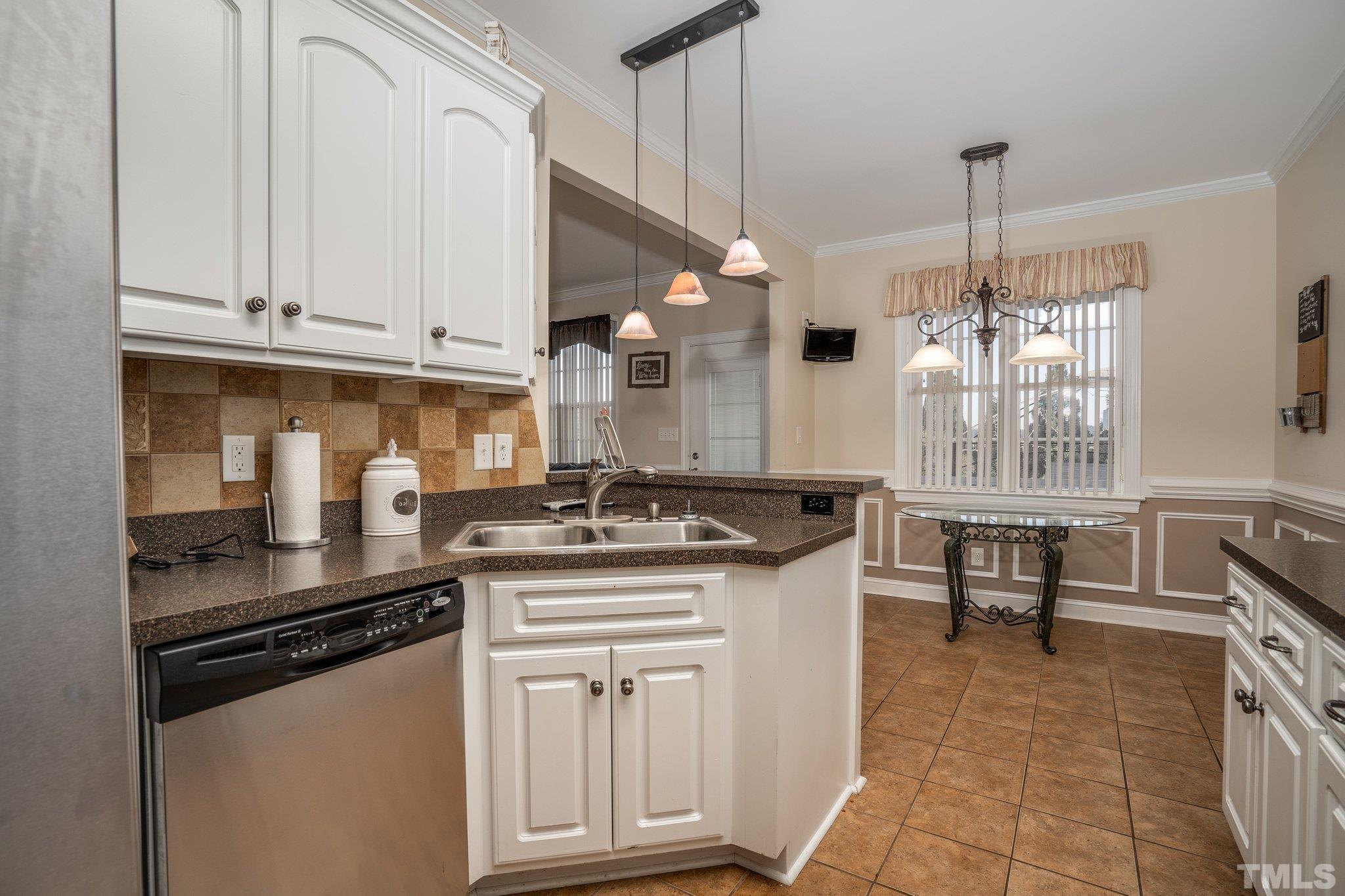 5058 Colorado Road Bailey, NC 27807 - Photo 9 of 27 a kitchen with stainless steel appliances granite countertop a stove a sink and a refrigerator