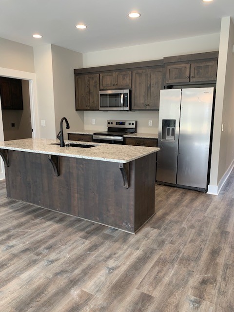4140 Riley Creek Road Normandy, TN 37360 - Photo 2 of 7 a kitchen with stainless steel appliances granite countertop a stove top oven a sink and a refrigerator