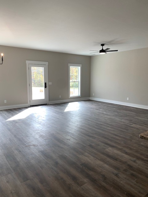 4140 Riley Creek Road Normandy, TN 37360 - Photo 3 of 7 an empty room with wooden floor and windows