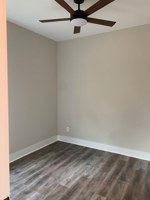 4140 Riley Creek Road Normandy, TN 37360 - Photo 5 of 7 a view of a room with wooden floor and a ceiling fan