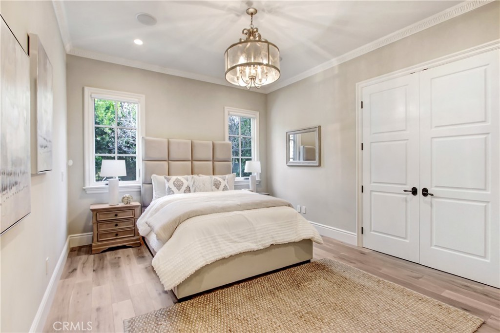 400 Santa Rosa Road Arcadia, CA 91007 - Photo 25 of 47 a bedroom with a bed and a chandelier