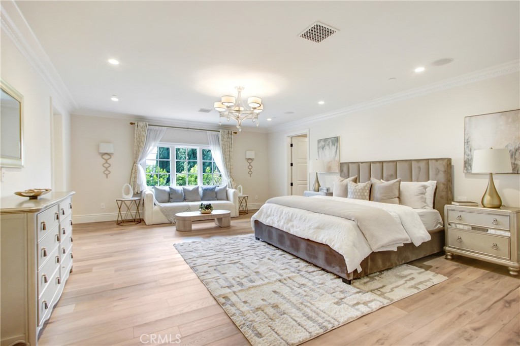 400 Santa Rosa Road Arcadia, CA 91007 - Photo 35 of 47 a spacious bedroom with a large bed and a chandelier