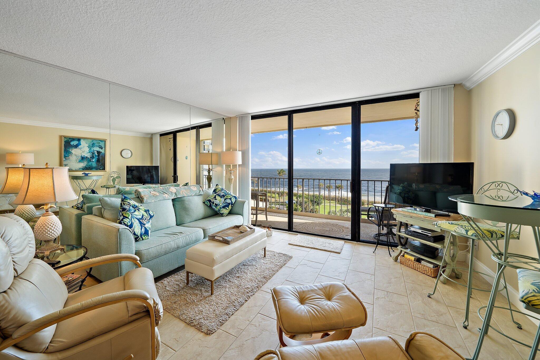 100 Ocean Trail Way, Unit 609 Jupiter, FL 33477 - Photo 5 of 66 a living room with furniture and a flat screen tv