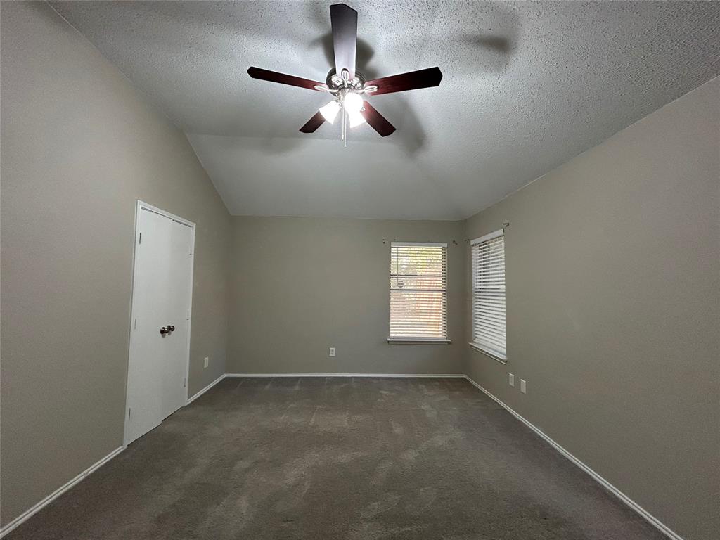 2816 Beaty Court Fort Worth, TX 76112 - Photo 12 of 24 wooden floor in an empty room with a window