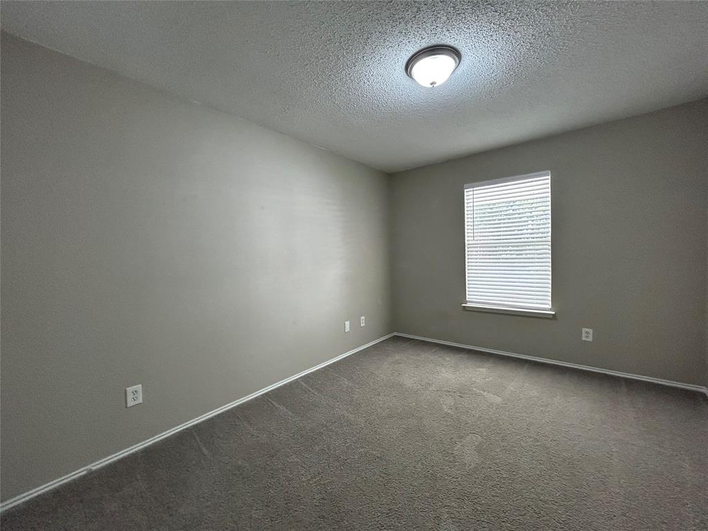 2816 Beaty Court Fort Worth, TX 76112 - Photo 15 of 24 an empty room with a window