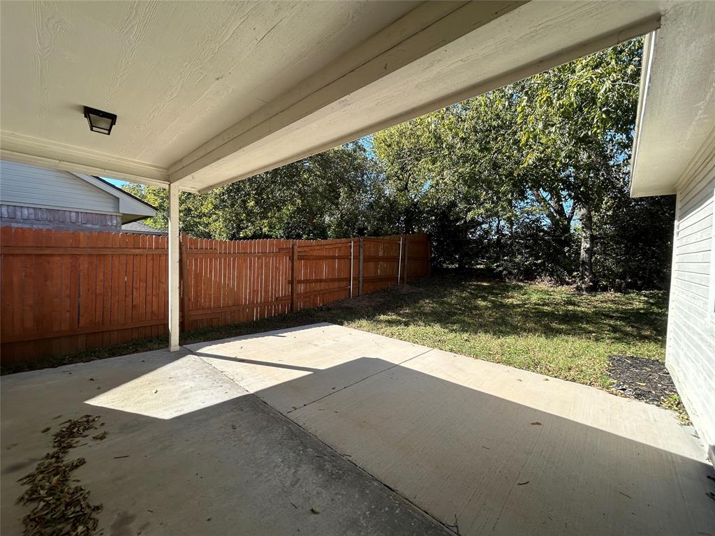 2816 Beaty Court Fort Worth, TX 76112 - Photo 23 of 24 a backyard of a house