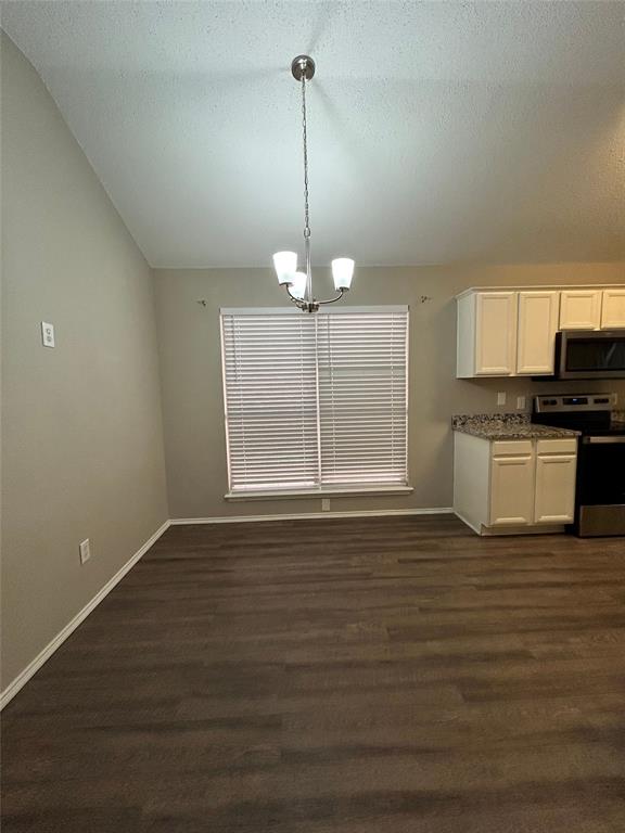 2816 Beaty Court Fort Worth, TX 76112 - Photo 5 of 24 a view of a kitchen with microwave and cabinets