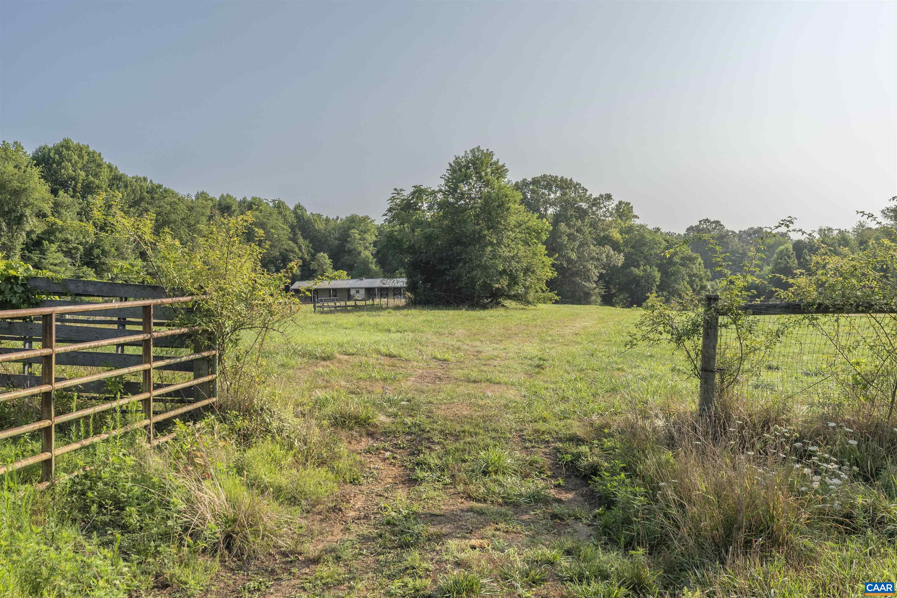 2599 Oak Park Road Madison, VA 22727 - Photo 35 of 43 a view of a garden with a building in the background