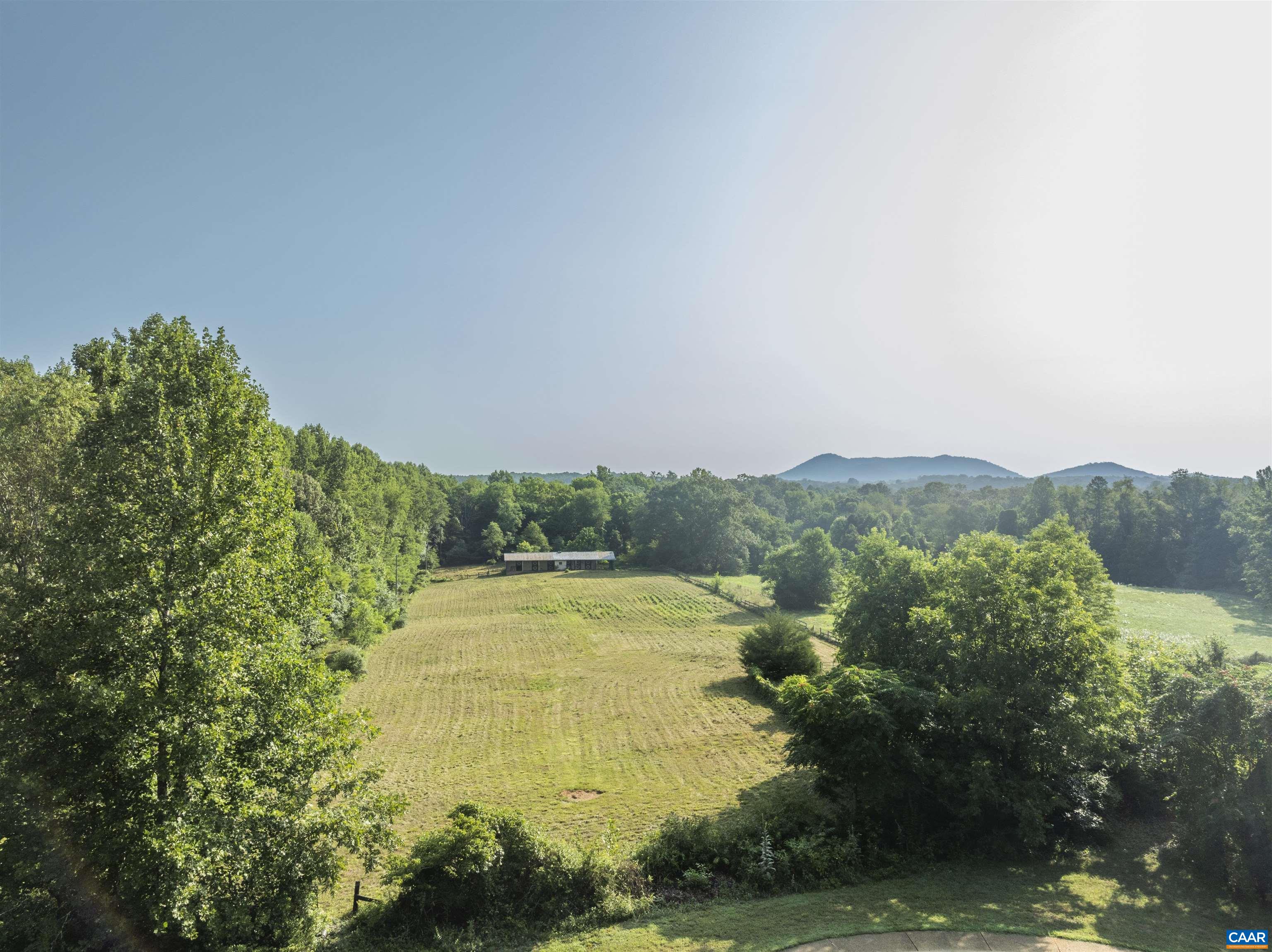 2599 Oak Park Road Madison, VA 22727 - Photo 6 of 43 a view of a swimming pool with a yard and mountain view