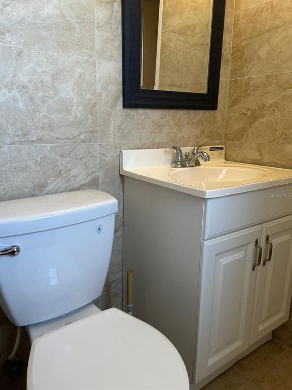1587 Wayman Road Moore Haven, FL 33471 - Photo 7 of 7 a bathroom with a toilet a sink and bathtub