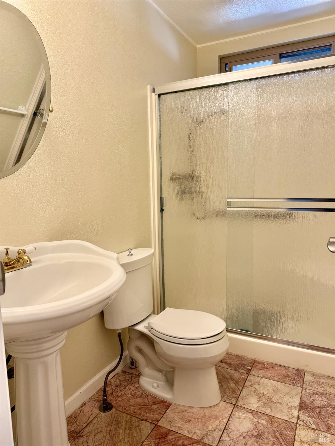1945 Piner Road, Unit 16 Santa Rosa, CA 95403 - Photo 12 of 21 a bathroom with a sink a toilet and a shower
