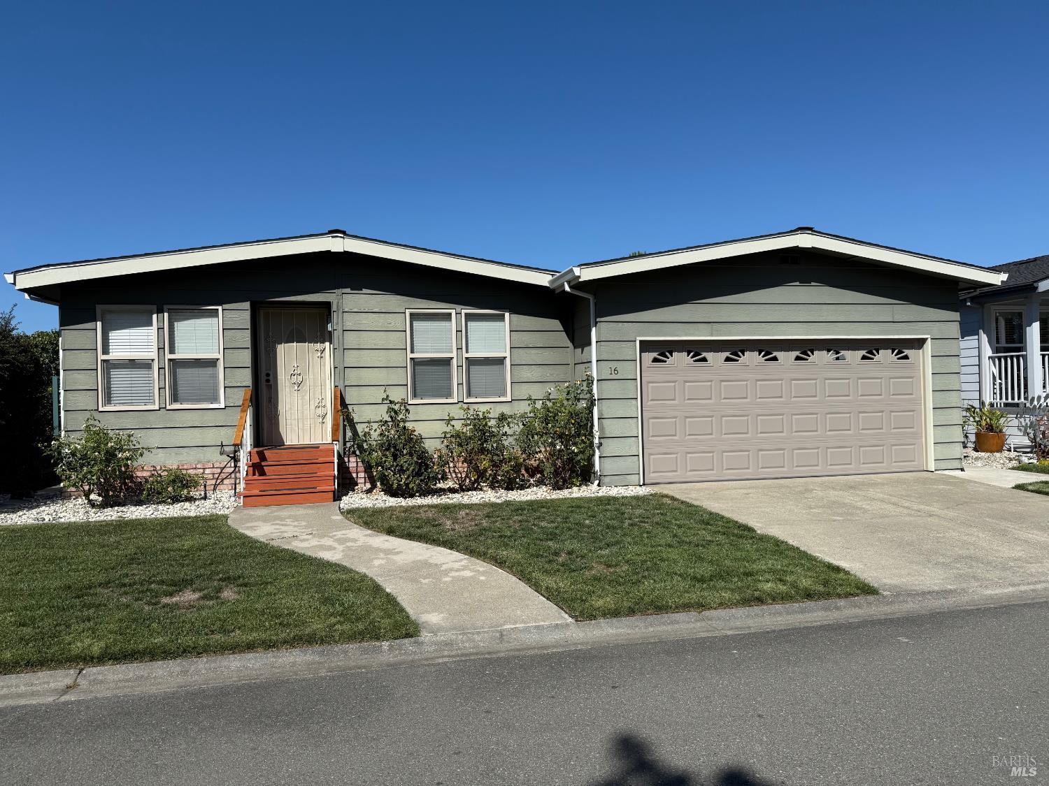 1945 Piner Road, Unit 16 Santa Rosa, CA 95403 - Photo 2 of 21 a front view of a house with a yard