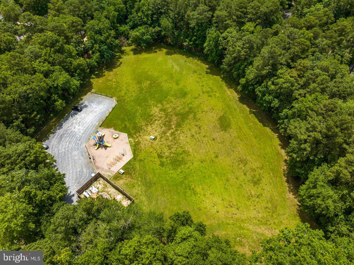26 Pinehurst Road Ocean Pines, MD 21811 - Photo 52 of 87 a view of a swimming pool and a yard