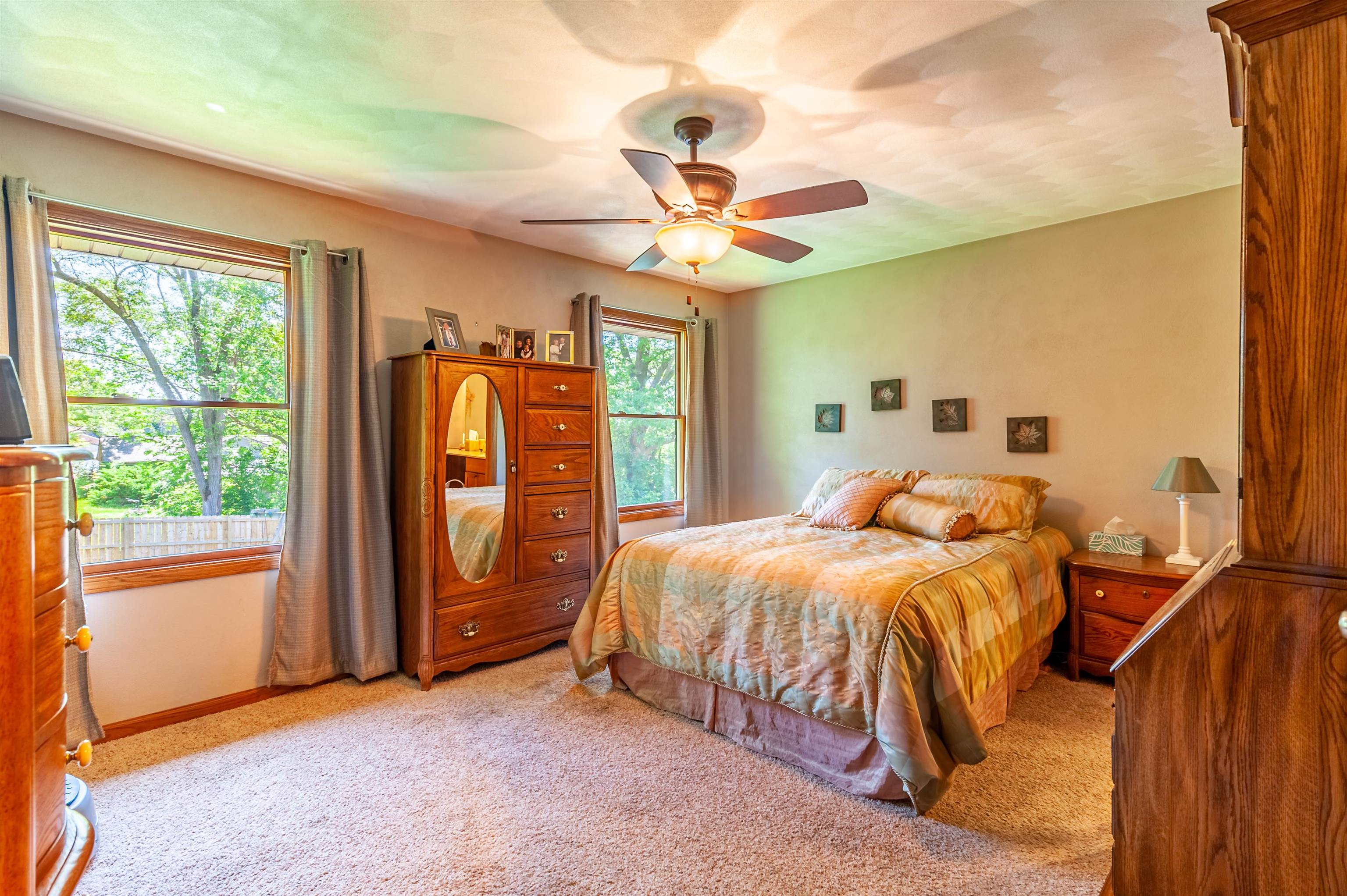 709 North Alpine Road Rockford, IL 61107 - Photo 23 of 47 a bedroom with a bed and a chandelier