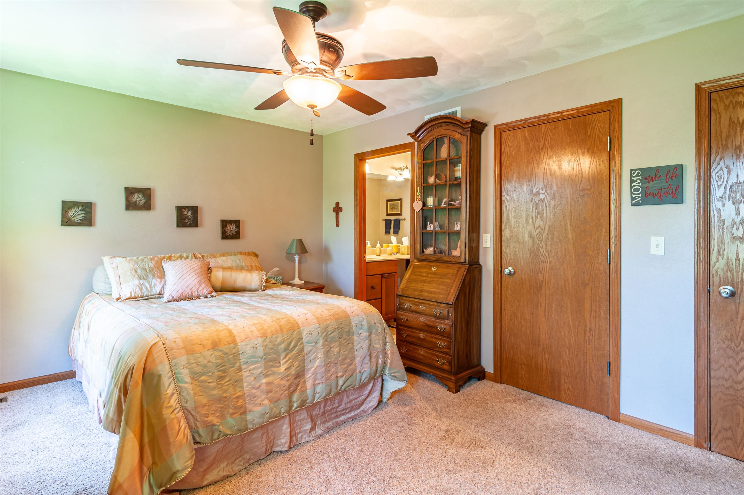 709 North Alpine Road Rockford, IL 61107 - Photo 24 of 47 a bedroom with a bed and a chandelier