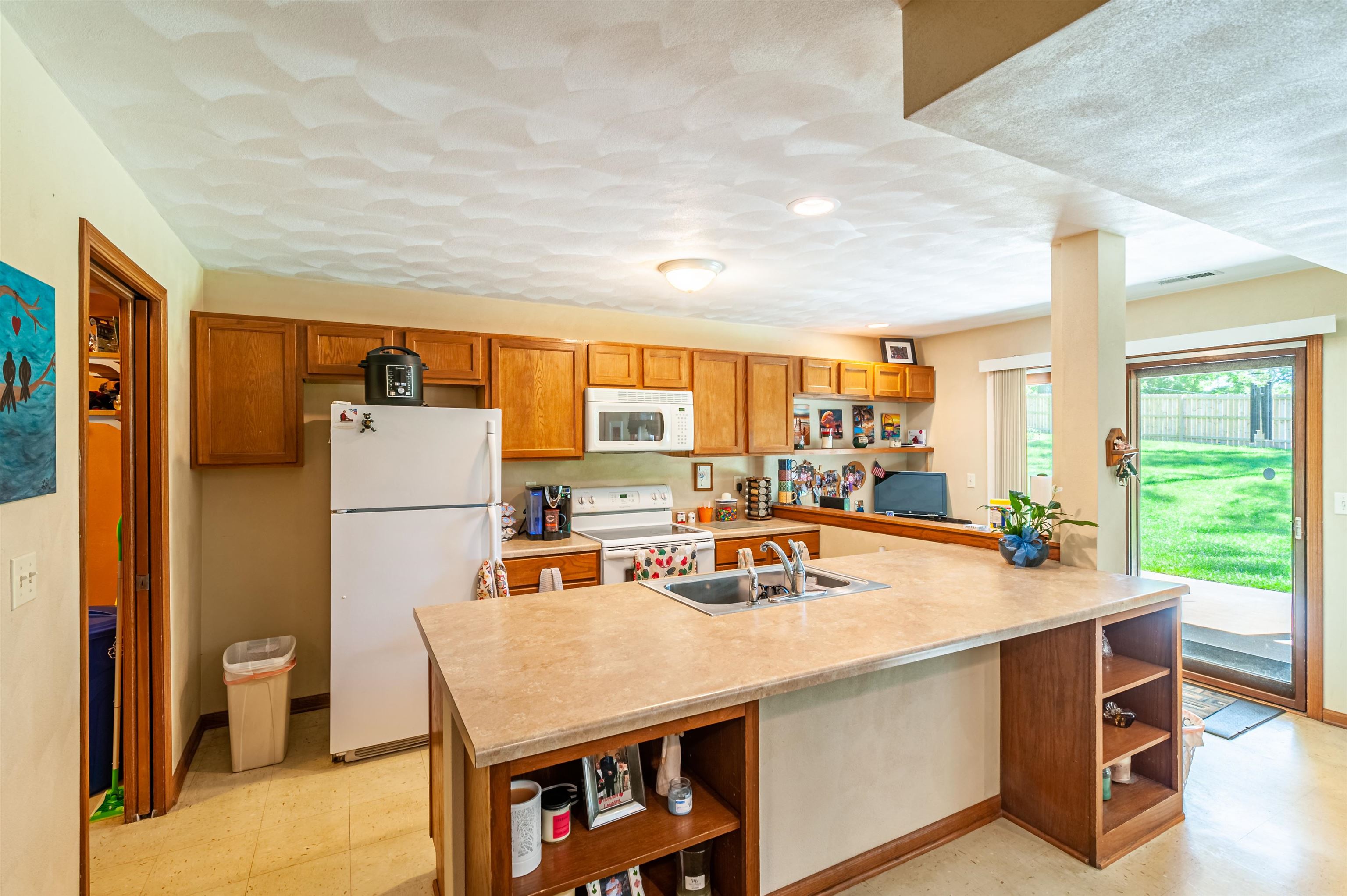 709 North Alpine Road Rockford, IL 61107 - Photo 32 of 47 a room with a table chairs and a refrigerator