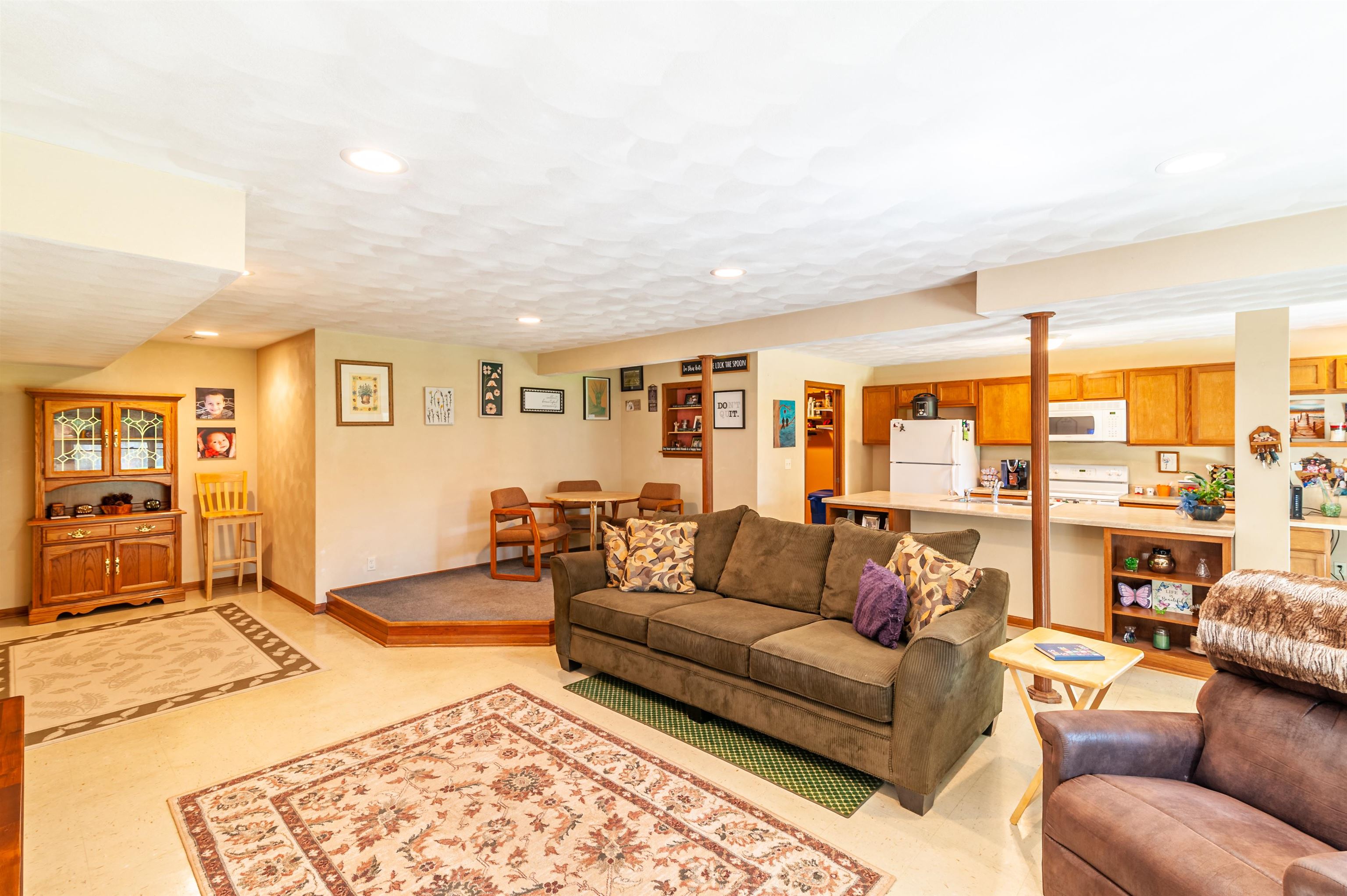 709 North Alpine Road Rockford, IL 61107 - Photo 35 of 47 a living room with furniture ceiling fan and a rug