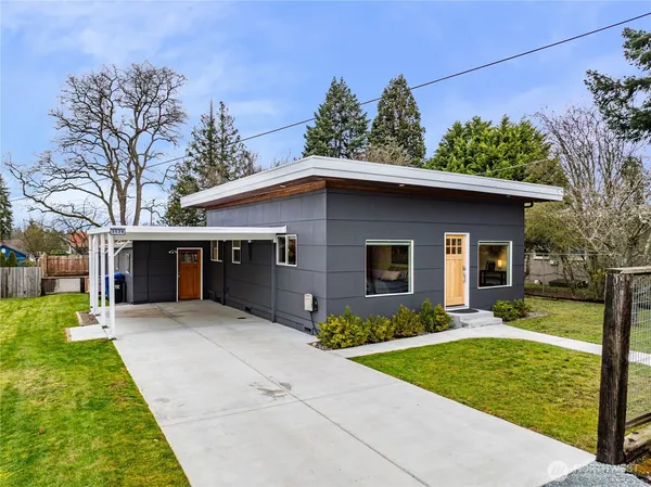 a front view of house with yard and green space
