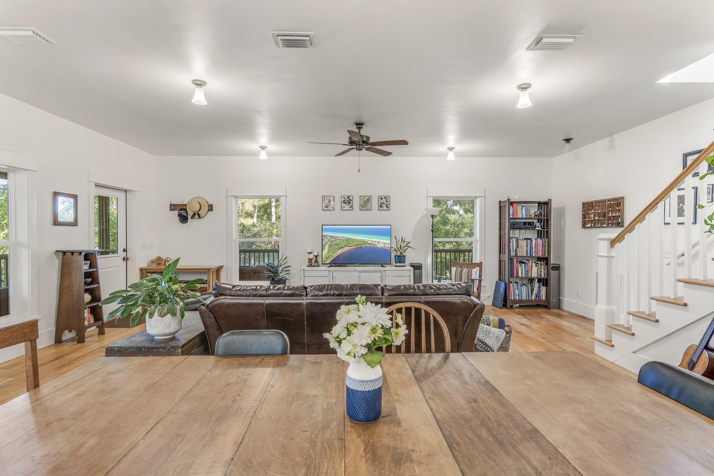 223 Grayton Trail Road Santa Rosa Beach, FL 32459 - Photo 13 of 22 a living room with furniture a couch and a chandelier