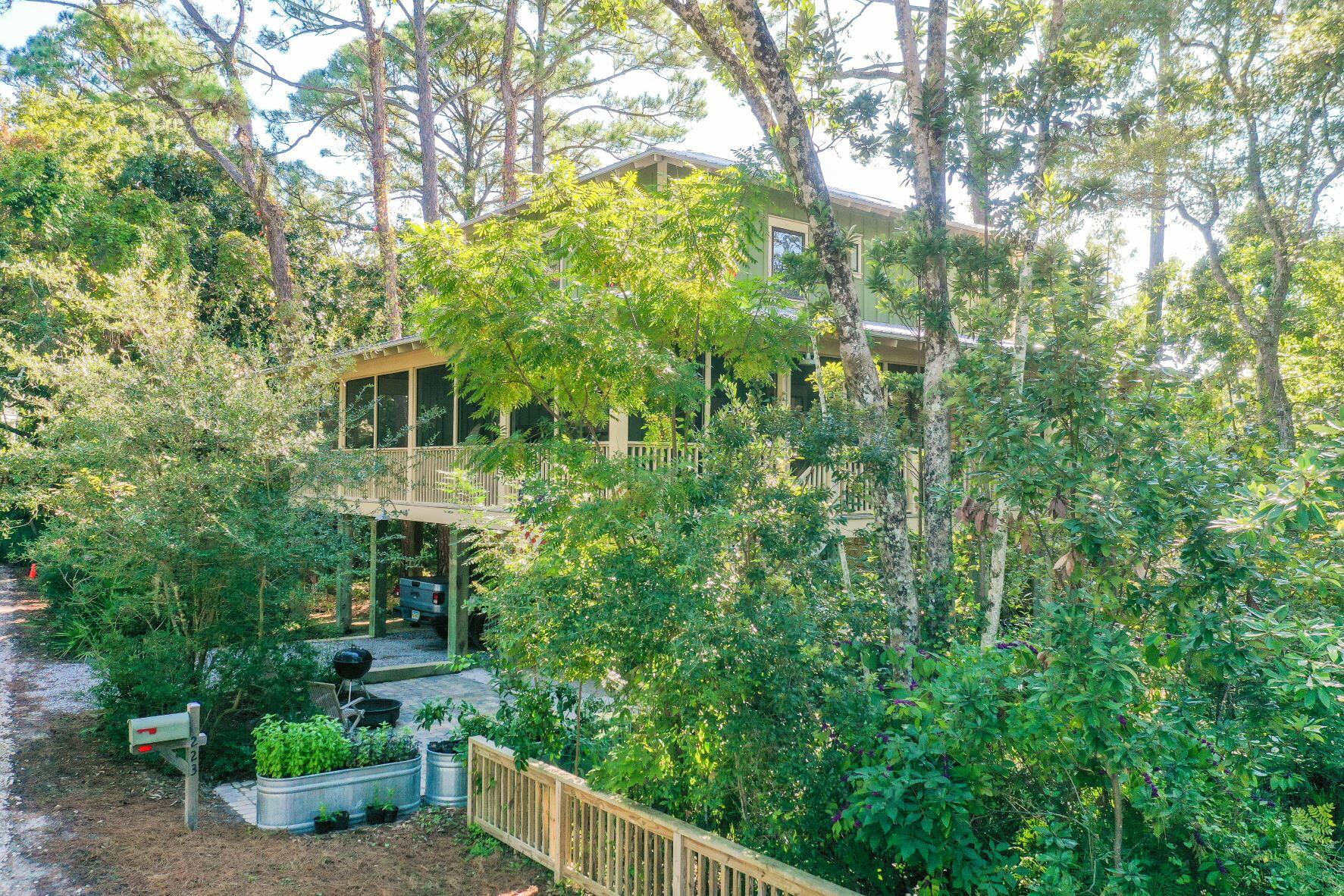 223 Grayton Trail Road Santa Rosa Beach, FL 32459 - Photo 2 of 22 a view of a house with a yard