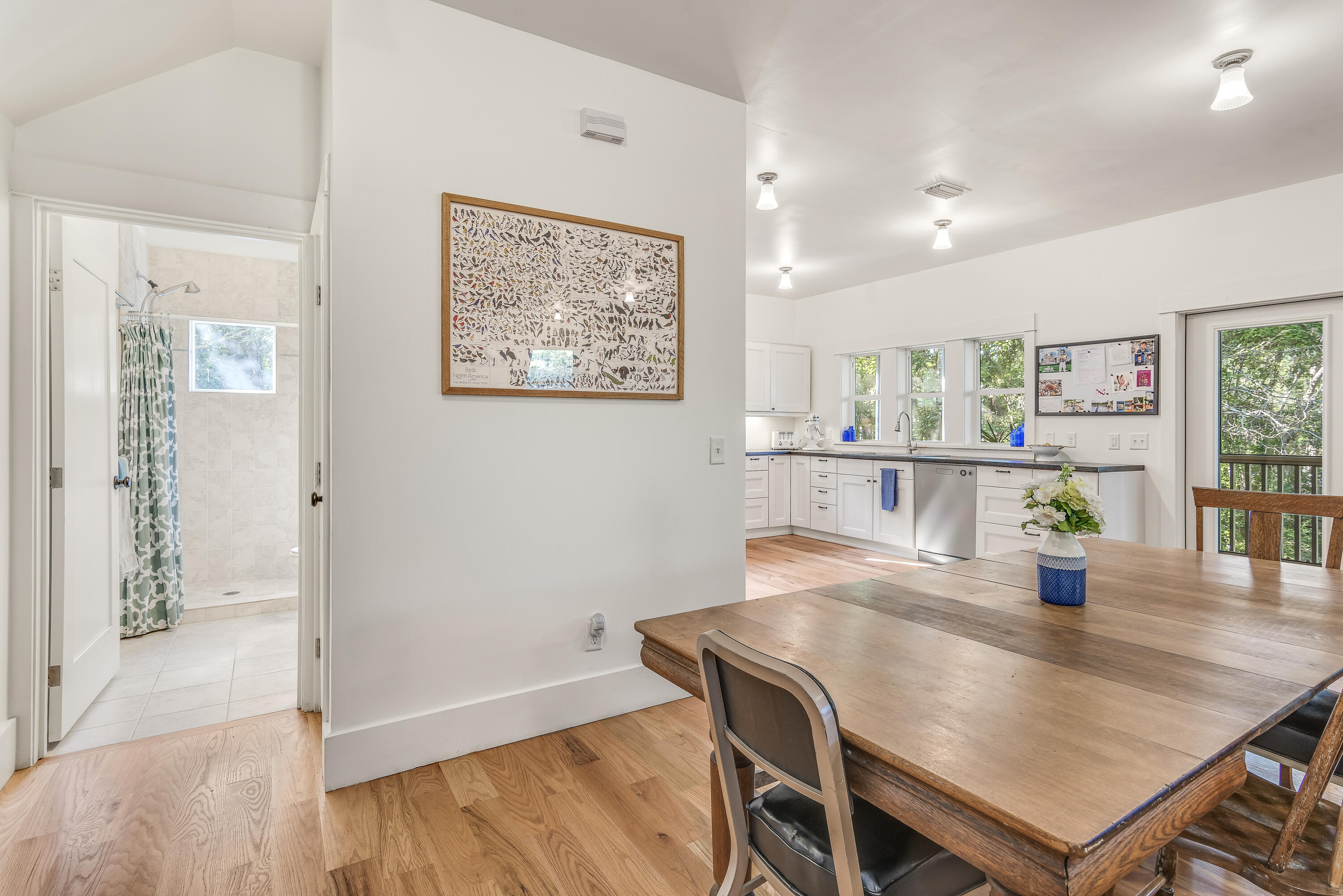 223 Grayton Trail Road Santa Rosa Beach, FL 32459 - Photo 7 of 22 a view of a dining room with furniture and wooden floor