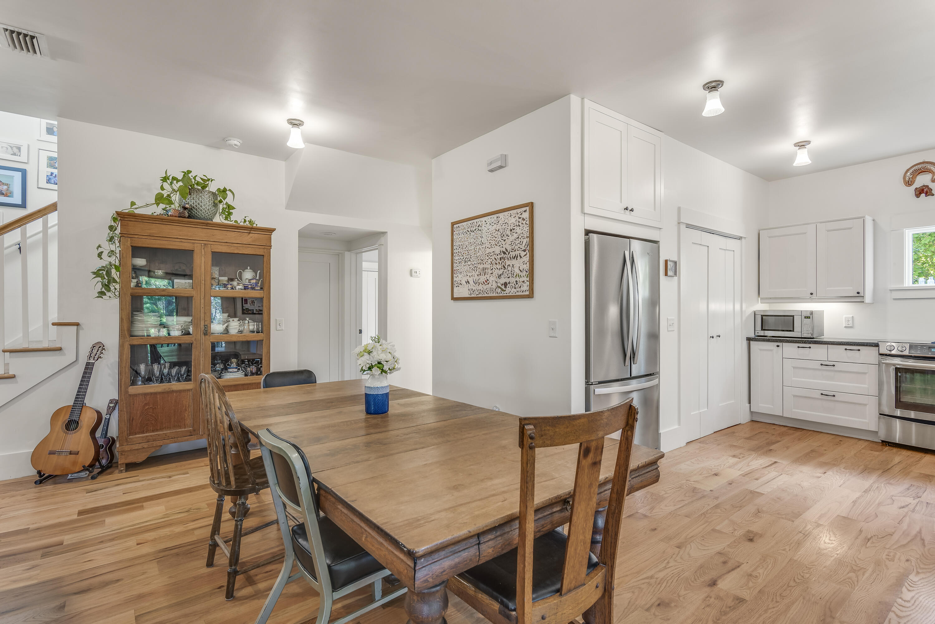 223 Grayton Trail Road Santa Rosa Beach, FL 32459 - Photo 8 of 22 a kitchen with white cabinets and stainless steel appliances