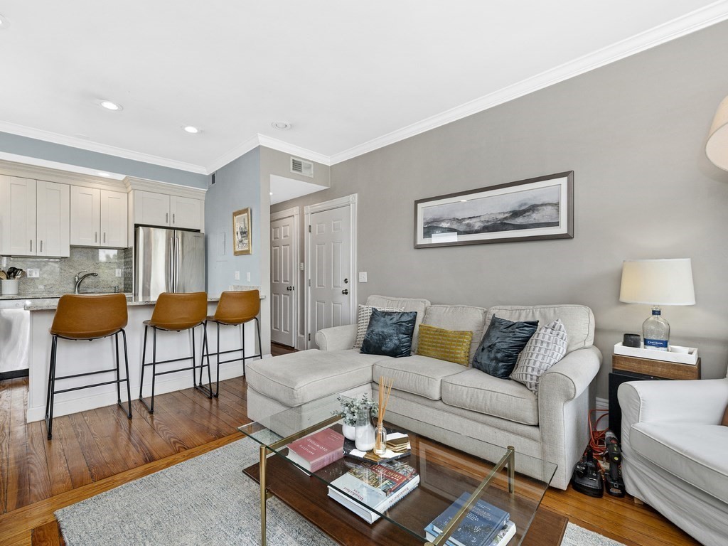 a living room with furniture and a table