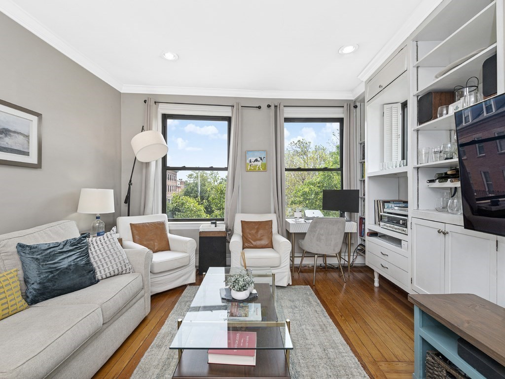 58 Winthrop Street, Unit 3 Boston, MA 02129 - Photo 3 of 14 a living room with furniture fireplace and a large window