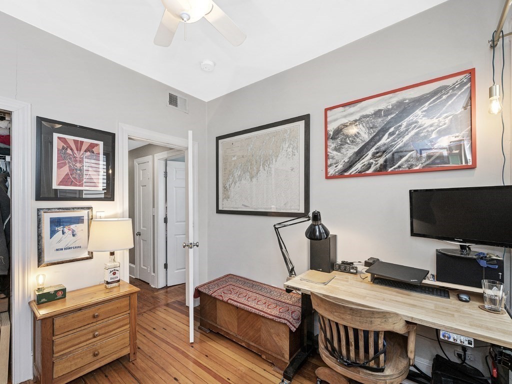 58 Winthrop Street, Unit 3 Boston, MA 02129 - Photo 8 of 14 a bedroom with furniture and a flat screen tv