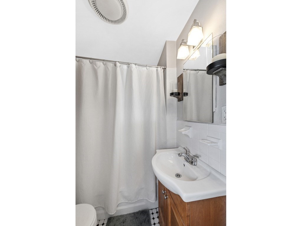 58 Winthrop Street, Unit 3 Boston, MA 02129 - Photo 9 of 14 a bathroom with a sink and a mirror