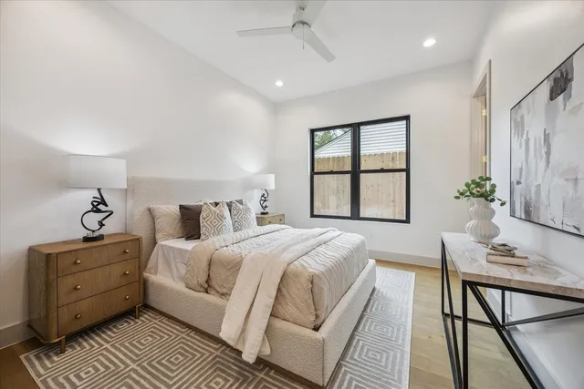 a bedroom with a bed and a table