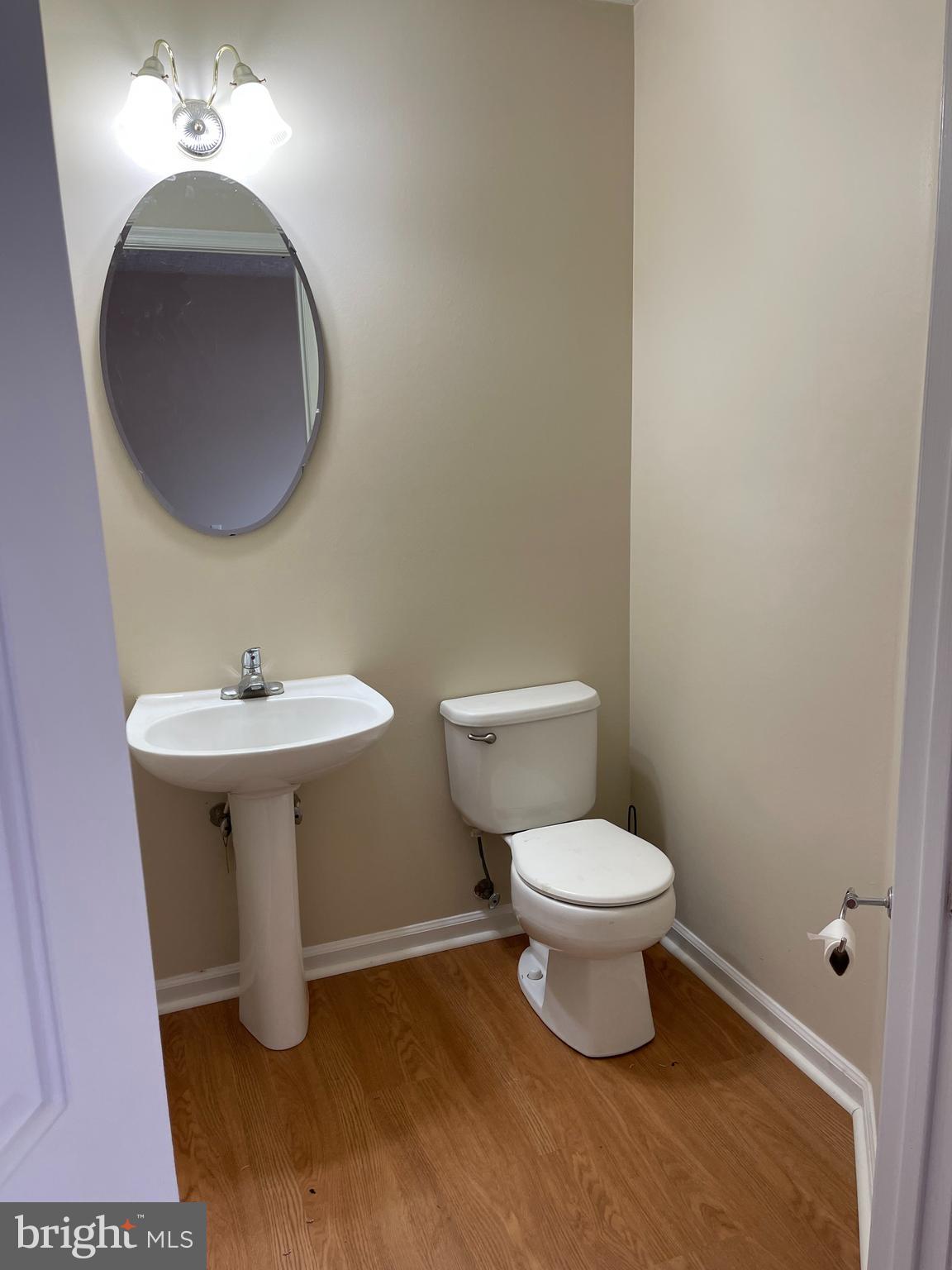 147 Foxview Drive Glen Burnie, MD 21061 - Photo 3 of 12 a bathroom with a sink and a toilet