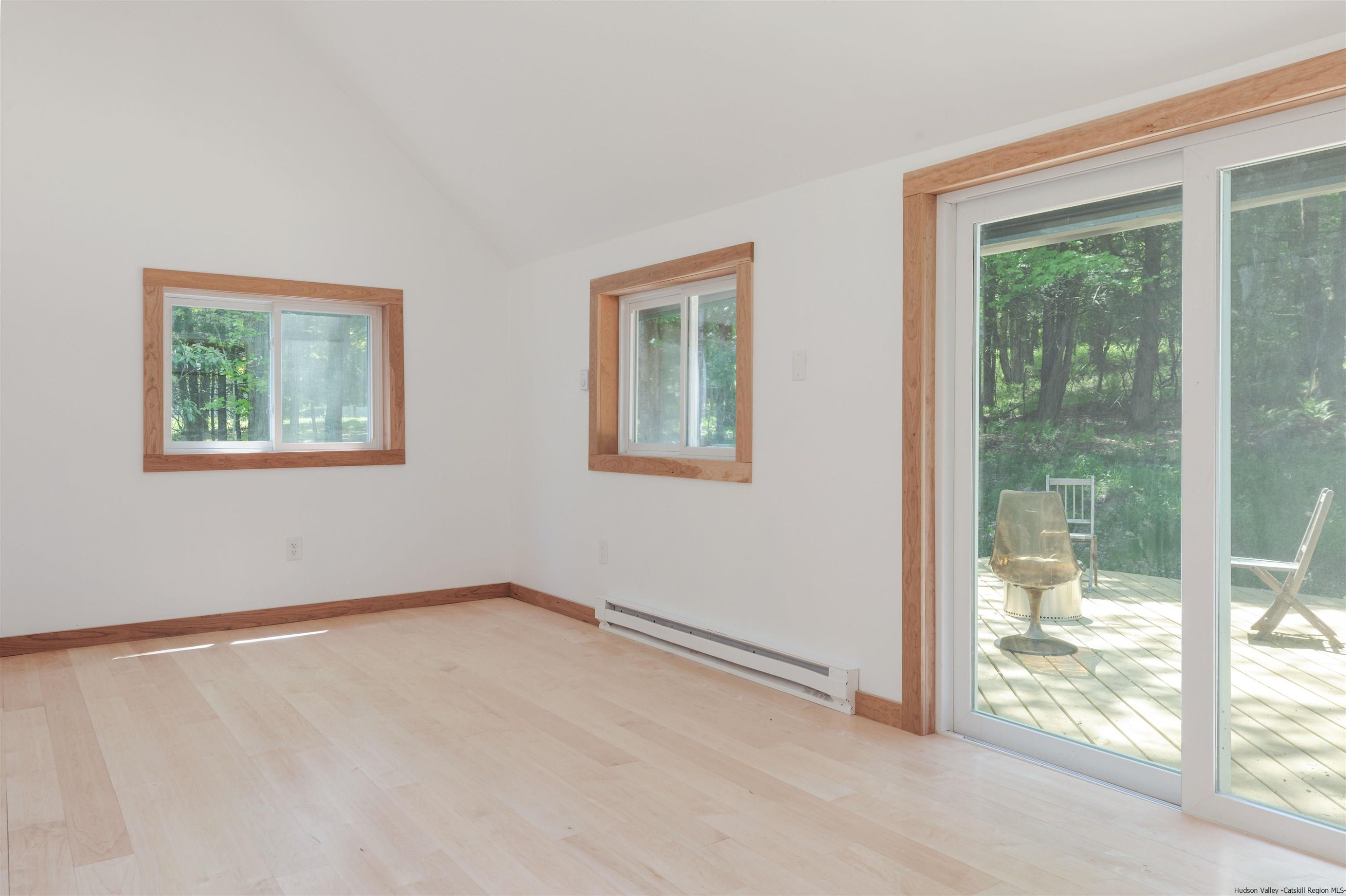 356 Mink Brook Road Colchester, NY 13755 - Photo 12 of 25 a view of an empty room with a window