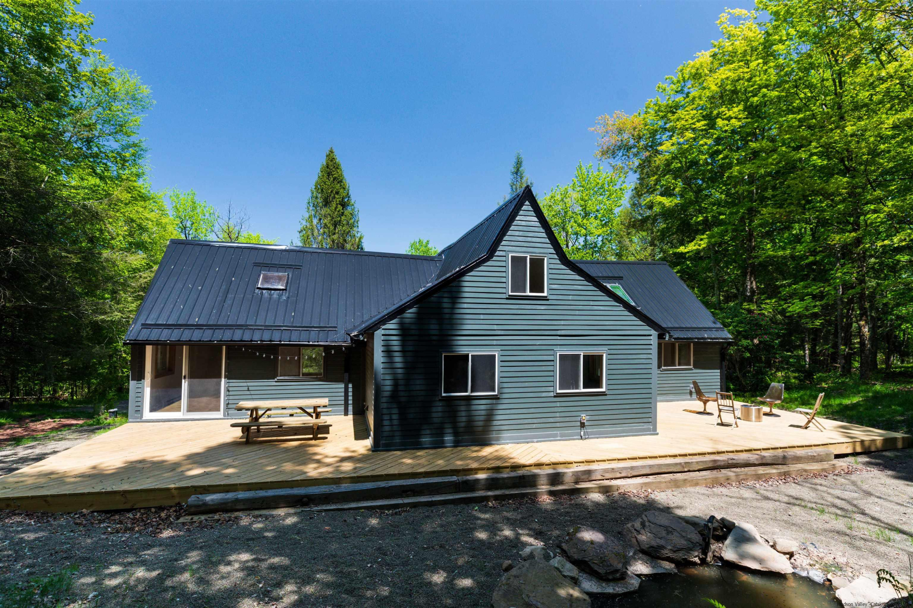 356 Mink Brook Road Colchester, NY 13755 - Photo 18 of 25 a front view of a house with a yard