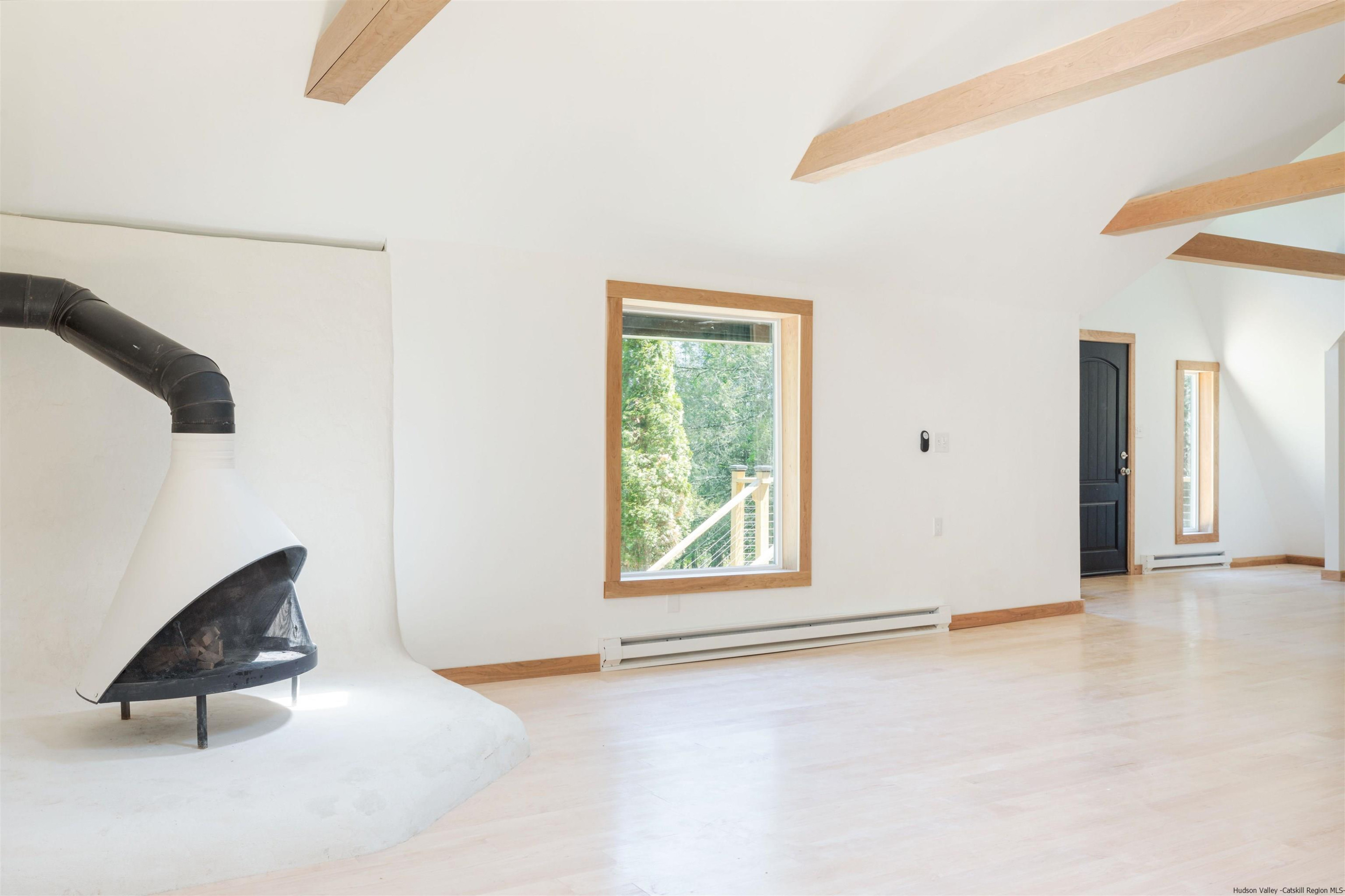 356 Mink Brook Road Colchester, NY 13755 - Photo 23 of 25 an empty room with windows