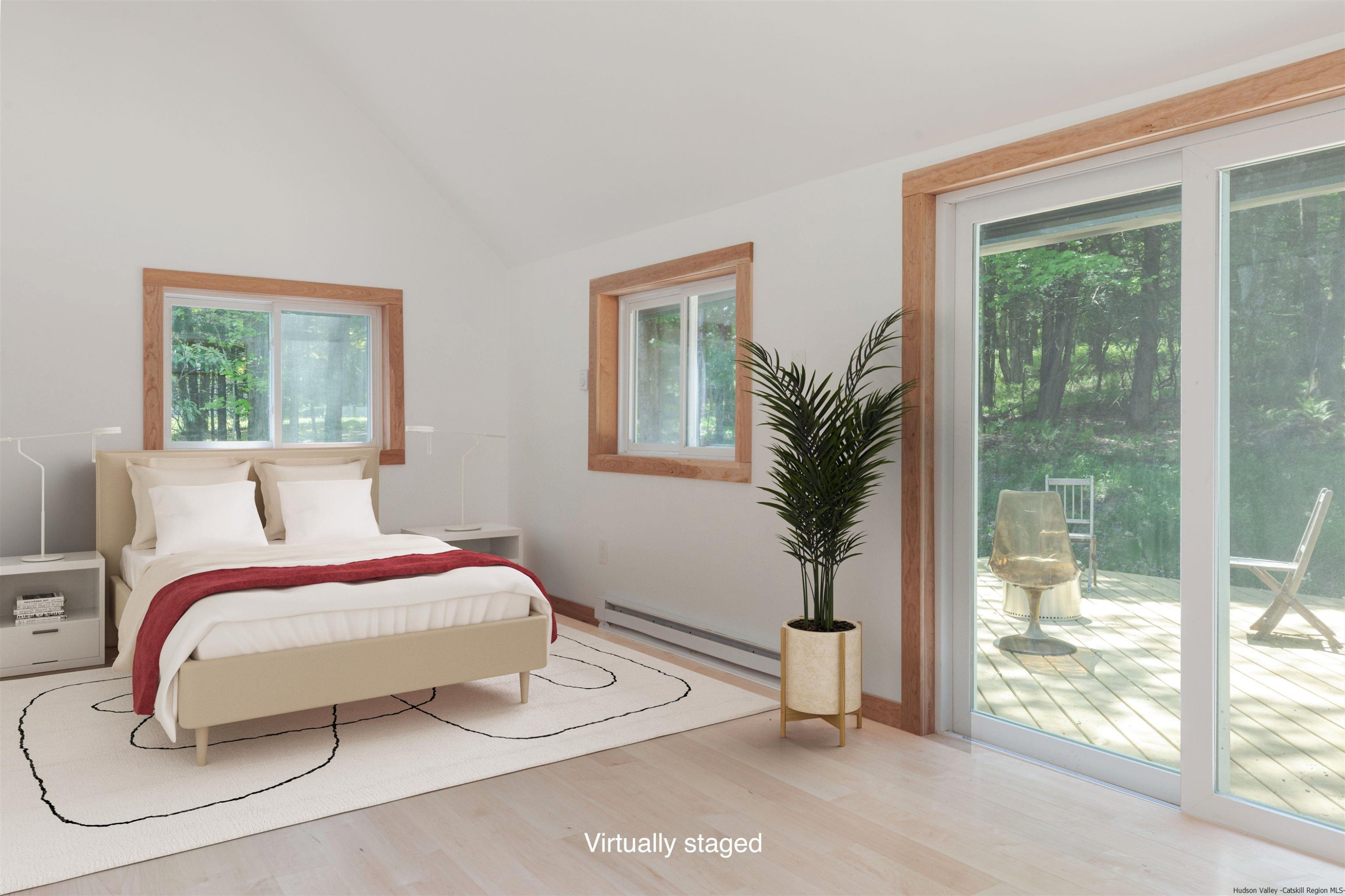 356 Mink Brook Road Colchester, NY 13755 - Photo 4 of 25 a bedroom with a large bed and a large window