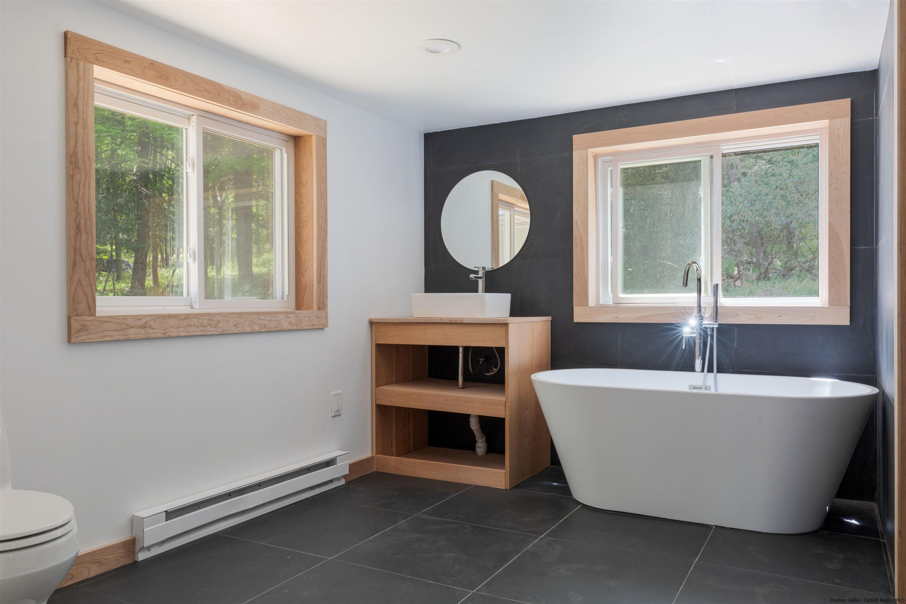 356 Mink Brook Road Colchester, NY 13755 - Photo 7 of 25 a living room with a couch and a window